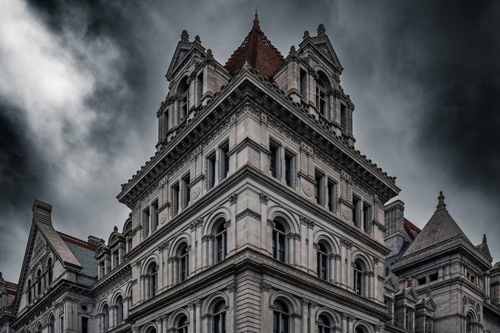 An imposing government building under dramatic skies